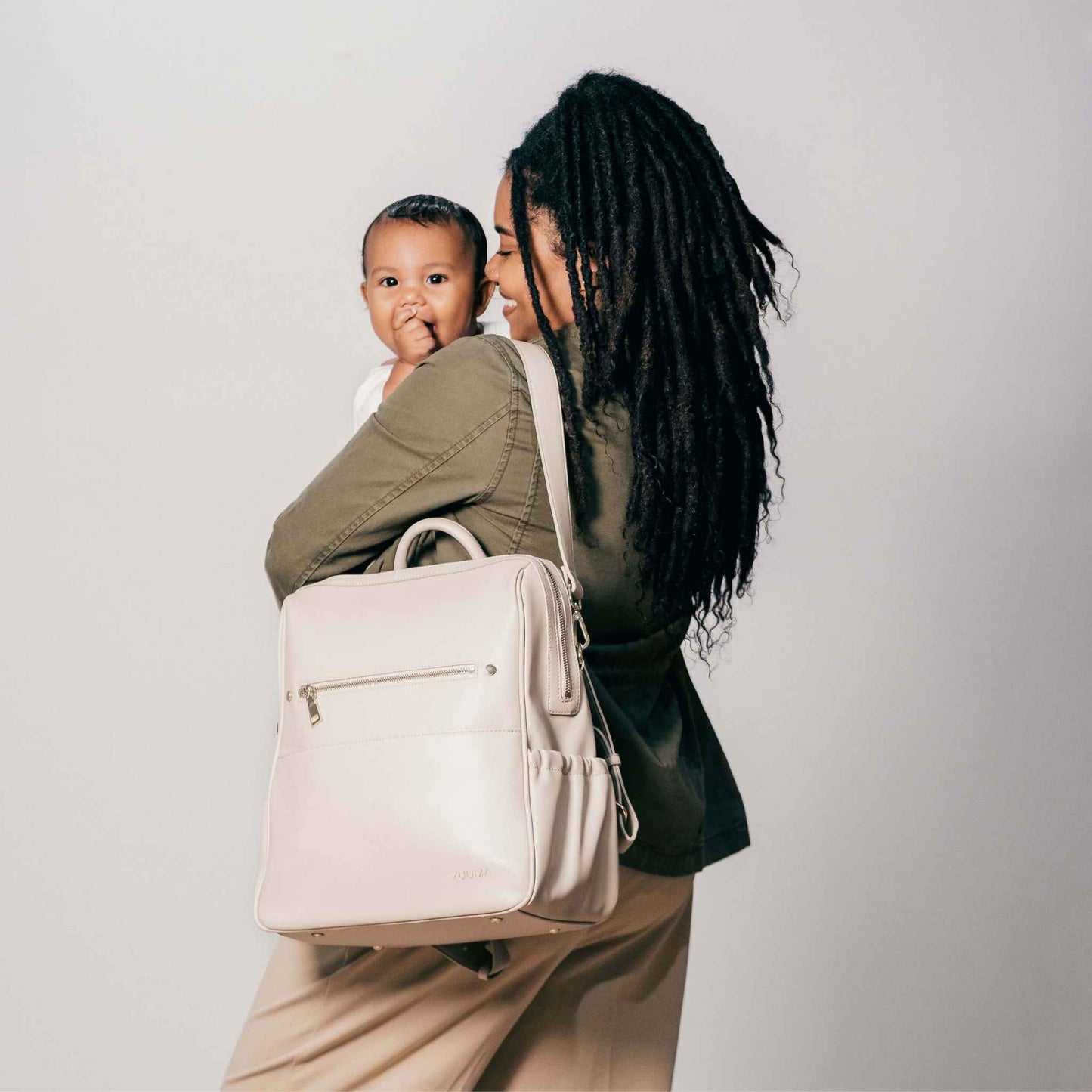 mom and baby with diaper bag from yuuma collection