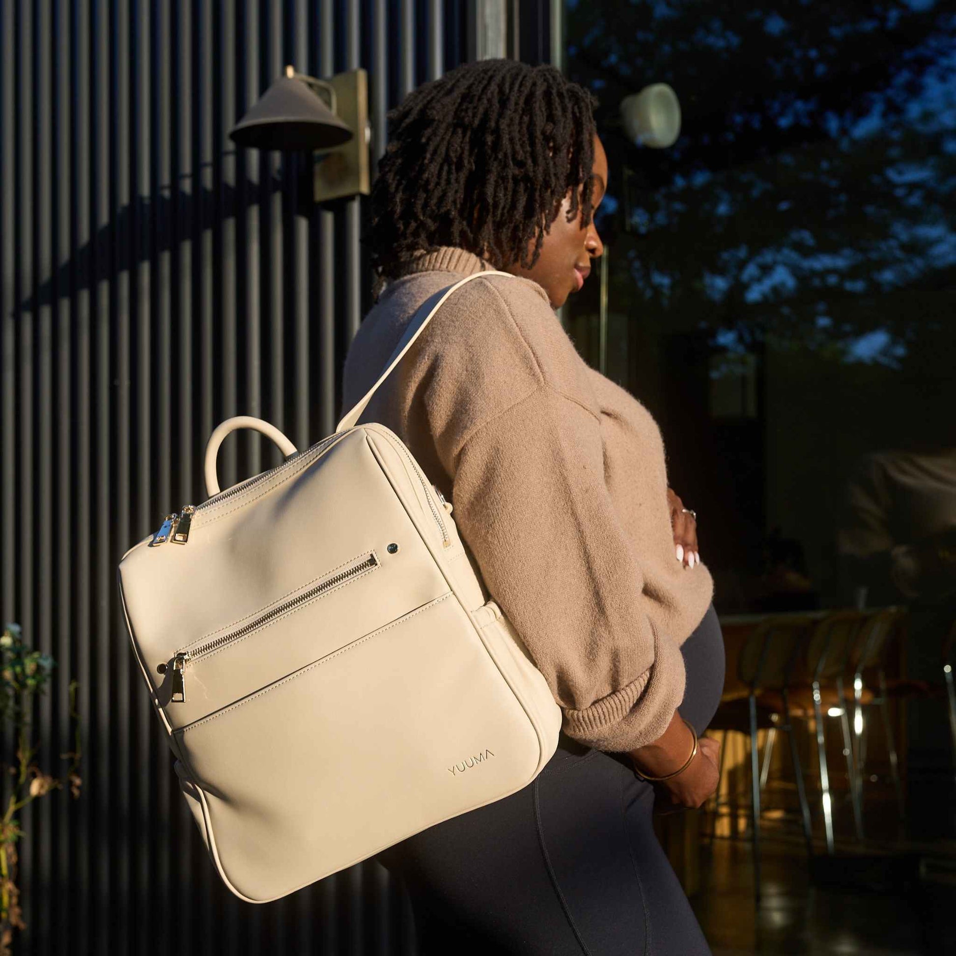 pregnant woman with ivory diaper bag from yuuma collection
